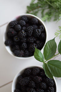 High angle view of blackberries in bowl on table