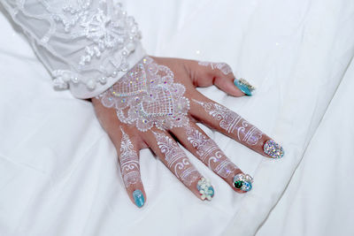 Close-up of woman hand with nail art