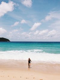 Full length of man on beach against sky