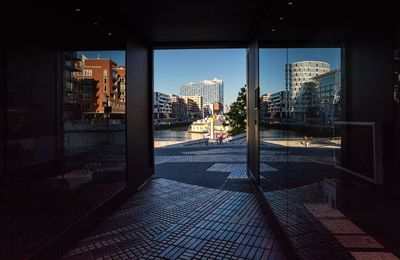 Illuminated cityscape against sky at night