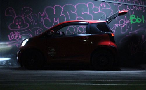 Close-up of car on illuminated street