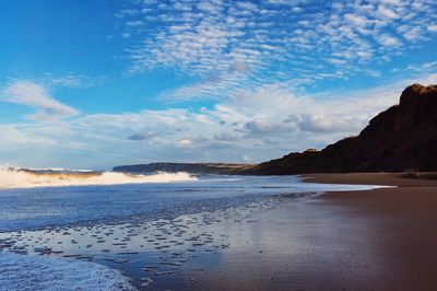 Scenic view of beach against sky