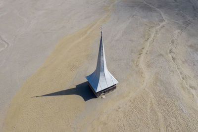 Aerial view of a toxic waste lake, with chemical residuals flooded a church. geamana, romania