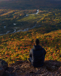 Rear view of hiker looking at view