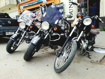 Bicycles parked against wall