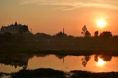 Scenic view of lake against sky during sunset