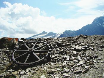 Built structure on landscape against mountain range