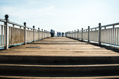 Pier on railing by river