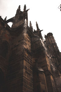 Low angle view of old building against sky