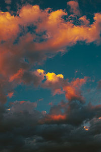 Low angle view of dramatic sky during sunset