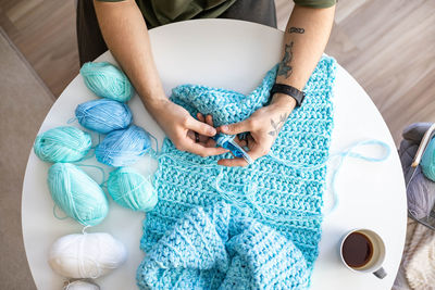 Midsection of woman holding heart shape