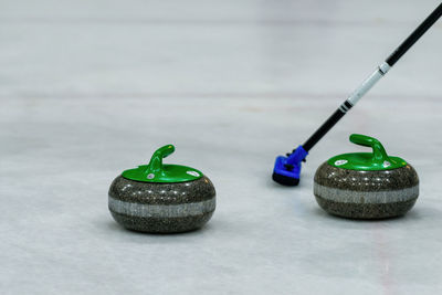 Close-up of curling stones on ice rink