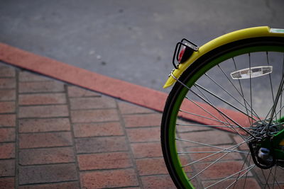 Close-up of bicycle parked on road