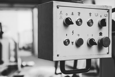 Close-up of knobs on machinery at industry