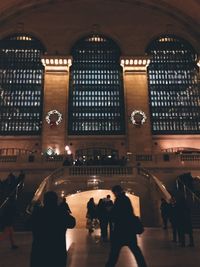 Group of people in illuminated building