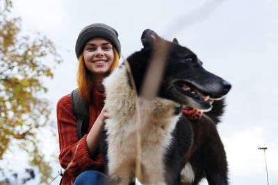 Portrait of smiling young woman in snow