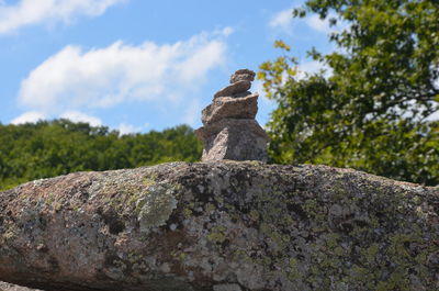 Low angle view of stone wall against sky