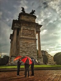 Low angle view of statue against cloudy sky