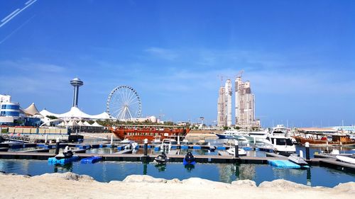 View of harbor against blue sky