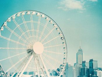 Low angle view of ferris wheel against sky