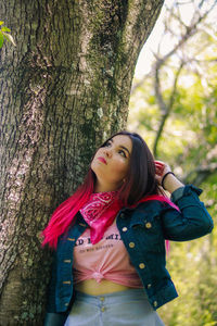 Smiling young woman in park