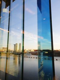 Reflection of buildings on glass window