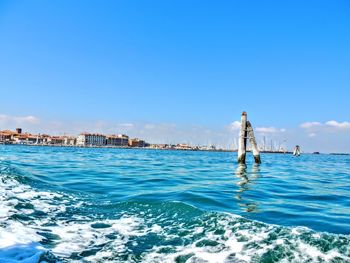 Scenic view of sea against clear blue sky