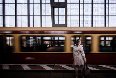 Blurred motion of train at railroad station