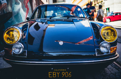 Close-up of vintage car on street