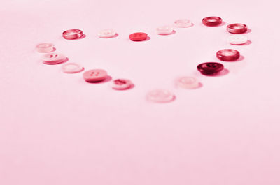 Close-up of pills on pink background