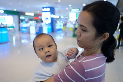 Woman with baby in mall