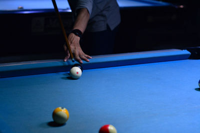 Man playing with ball on table