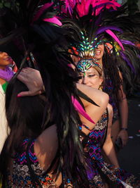 Portrait of happy young woman dancing at night