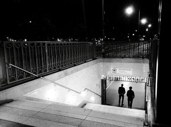 People walking on railing