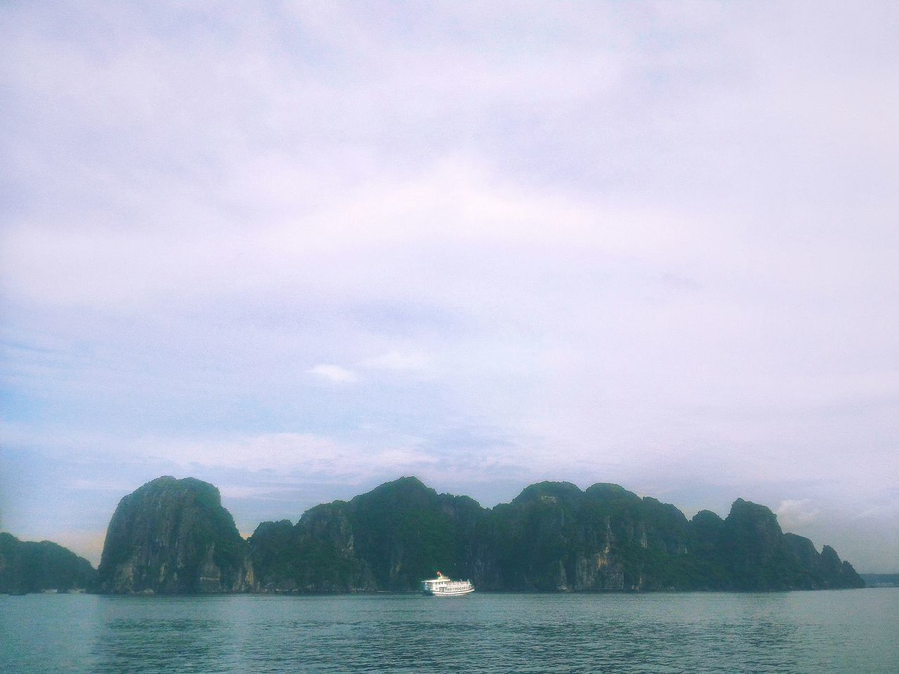 water, sky, cloud - sky, nautical vessel, beauty in nature, sea, scenics - nature, nature, transportation, tranquility, mountain, tranquil scene, waterfront, day, no people, mode of transportation, outdoors, travel destinations, idyllic, bay