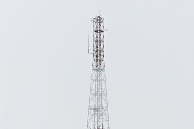 Low angle view of communications tower against clear sky