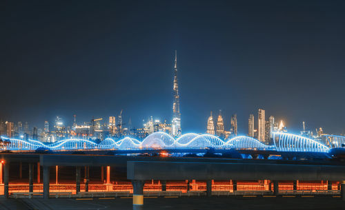 Illuminated buildings in city at night