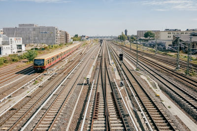 High angle view of railroad tracks in city against sky