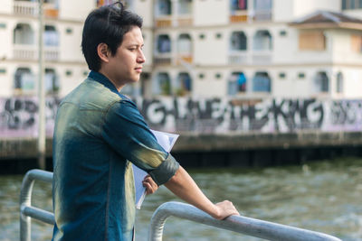 Side view of young man looking away