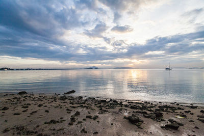 Scenic view of sea against sky at sunset