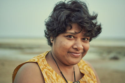 A casual looking indian tourist girl at shankarpur sea beach, in west bengal.