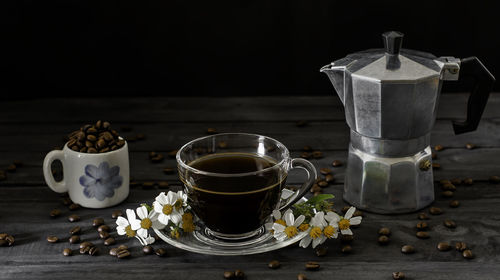 Close-up of coffee served on table