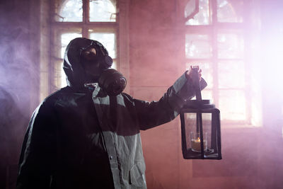 Man photographing through window