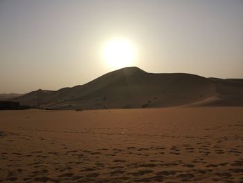 Scenic view of desert against clear sky