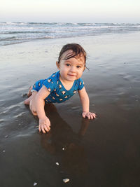 Portrait of baby boy on beach