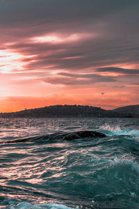 Scenic view of sea against sky during sunset