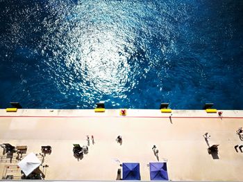 High angle view of people swimming in pool