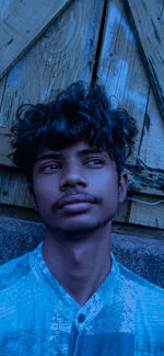Portrait of young man standing outdoors