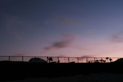 Silhouette bridge against sky during sunset