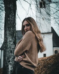 Portrait of woman standing outdoors